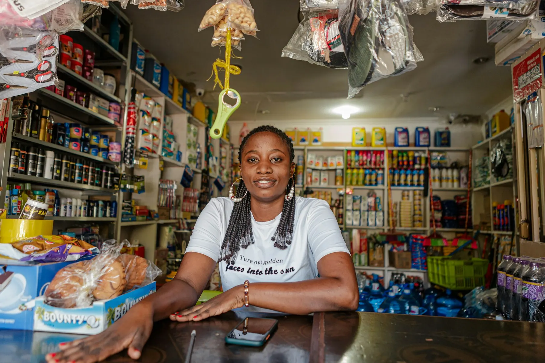 A shop owner behind her counter